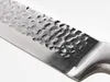 A close-up shot of a knife blade with a hammered texture. Náhled obrázku produktu