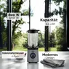 A glass stand mixer is displayed on a countertop with a blurred background of trees and windows. Text overlays highlight product features. Produktbild-Vorschau