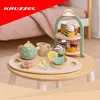 A wooden toy tea set with a tiered stand is displayed on a small wooden table. Produktbild-Vorschau