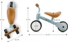 Two views of a blue balance bike with dimensions indicated by arrows and text. Voir les images du produit