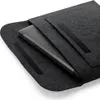 A laptop sleeve with a laptop partially inserted. Anteprima dell’immagine prodotto