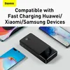 A black power bank is shown with several smartphones around it, suggesting compatibility and fast charging capabilities. Podgląd zdjęcia produktu