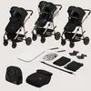 A collection of baby stroller components and accessories laid out on a light gray background. Produktbild-Vorschau