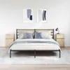 A bedroom scene with a bed, nightstands, and artwork. Náhľad obrázku produktu