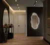 A modern hallway with a decorative mirror and ambient lighting. Produktbild-Vorschau
