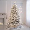 A decorated Christmas tree with lights and ornaments, set up in a room with a fireplace and presents underneath. Anteprima dell’immagine prodotto