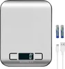A silver digital kitchen scale with batteries and a USB cable. Produktbild-Vorschau