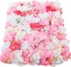 A close-up view of a wall of artificial flowers in various shades of pink, white, and red. Produktbild-Vorschau