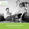 A couple is playfully interacting with a pillow on a sofa in a living room. Náhled obrázku produktu