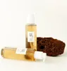 Two bottles of cleansing oil and a piece of dark, porous rock. Anteprima dell’immagine prodotto