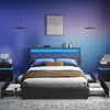 A modern bedroom with a bed featuring LED lighting, nightstands, and open storage drawers. Náhled obrázku produktu