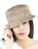 A young woman wearing a bucket hat. Produktbild-Vorschau