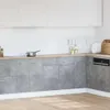 A modern kitchen with concrete-look cabinets and white upper cabinets. Produktbild-Vorschau