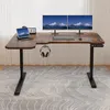 A modern L-shaped standing desk with dual monitors, a tablet, keyboard, mouse, and headphones. Produktbild-Vorschau