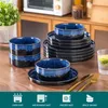 A set of blue and black ceramic dishes arranged on a wooden table, with kitchen cabinets and a plant in the background. Produktbild-Vorschau
