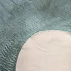 A close-up view of a rug, showing the texture of the material and the edge where the top and bottom layers meet. Anteprima dell’immagine prodotto