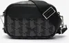 A black Lacoste crossbody bag with a geometric pattern. Náhľad obrázku produktu