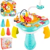 A children's interactive musical activity table with various toys and features, along with some accessories and packaging shown separately. Produktbild-Vorschau