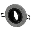 A close-up studio shot of a round, concrete-look recessed light fixture with a black inner ring and spring clips. Produktbild-Vorschau