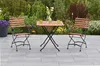 A garden setting with a table and chairs. Produktbild-Vorschau