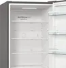 The interior of an open refrigerator with shelves. Produktbild-Vorschau
