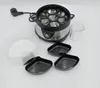 An egg cooker and its accessories are arranged on a white background. Produktbild-Vorschau