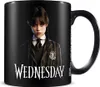 A black mug with the character Wednesday Addams printed on it. Podgląd zdjęcia produktu