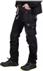 A person wearing black work pants and shoes. Produktbild-Vorschau