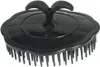 A black scalp massage brush is shown against a white background. Produktbild-Vorschau