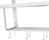 A close-up view of a white metal microwave oven rack with hooks. Podgląd zdjęcia produktu