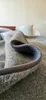 A close-up view of a folded blanket on a bed. Produktbild-Vorschau