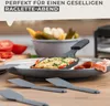 A close-up of a raclette set with spatulas and food. Produktbild-Vorschau