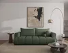 A modern living room with a green sofa, abstract art, and a floor lamp. Produktbild-Vorschau