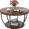 A round coffee table with a wooden top and black metal legs, decorated with a vase of roses, a cup of coffee, and a magazine. Anteprima dell’immagine prodotto