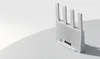 A white router with multiple antennas is placed on a white surface with a shadow. Náhľad obrázku produktu