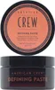 A top-down view of the lid of an American Crew Defining Paste hair product, followed by a front view of the jar. Podgląd zdjęcia produktu