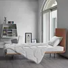 A bedroom scene with a bed, bedding, and a shelf. Produktbild-Vorschau