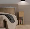 A bedroom scene with a bed and a nightstand. Anteprima dell’immagine prodotto