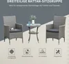 A three-piece rattan seating group with a table and two chairs, presented with feature icons and text. Produktbild-Vorschau