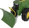 Close-up of a toy tractor with a snow plow attachment. Produktbild-Vorschau