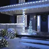 A house porch decorated with Christmas lights and a snowman figure. Produktbild-Vorschau