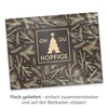 A flat-packed product with a festive Christmas design, wrapped in plastic. Produktbild-Vorschau