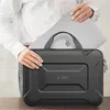 A person is holding a laptop and placing it into a laptop bag. Náhled obrázku produktu