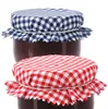 Two jars of jam with checkered fabric lids. Produktbild-Vorschau