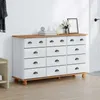 A dresser with drawers in a room setting. Voir les images du produit