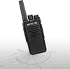 A black walkie-talkie is shown at an angle, resting on a surface that appears to be cracked or shattered. Produktbild-Vorschau