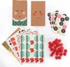 A collection of items for an advent calendar, including decorated paper bags, stickers, and small red pom-poms. Produktbild-Vorschau