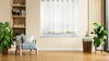 A living room scene with a chair, plants, and a window with white curtains. Produktbild-Vorschau