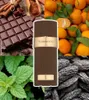 A collage of ingredients and a perfume bottle, suggesting the scent profile. Voir les images du produit