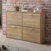 A wooden shoe cabinet with four flip-down drawers is shown against a brick wall. Decorative items are on top of the cabinet. Produktbild-Vorschau